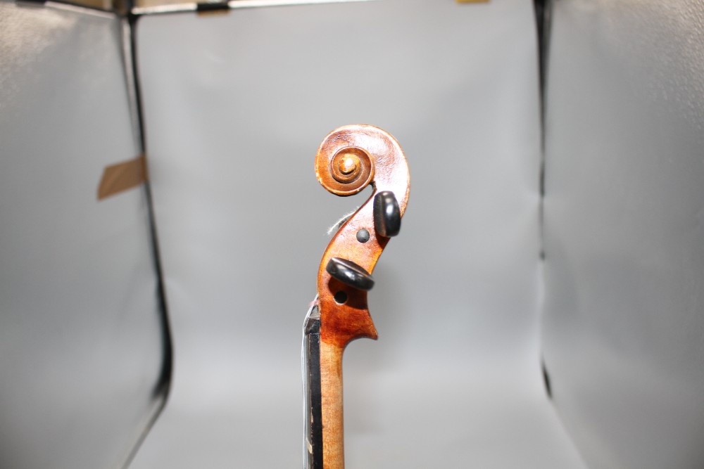 A violin with two piece back and bow, and a childs violin with bow, both with cases